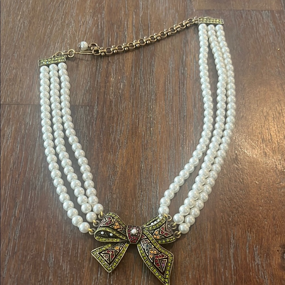 Heidi Daus 3 strand necklace with Bow Pendant